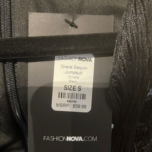 Grace Black Sequin Fringe Jumpsuit NWT peekaboo sheer down the leg. Sexy & ready